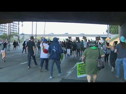 Thumbnail for Demonstrators march on 110 Freeway by downtown LA after Roe v. Wade overturned