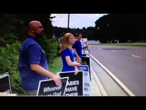 Thumbnail for Pro choice man pulls gun on pro-life protesters