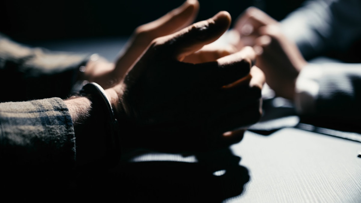 Handcuffs symbolizing criminal manslaughter charges filed against Colorado family in assisted suicide prosecution