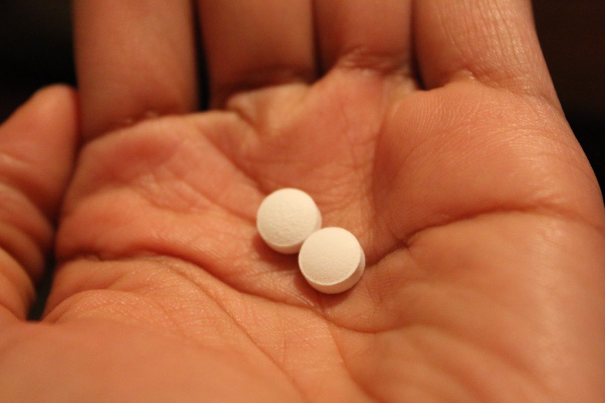 abortion, Pills in Black Woman's hand