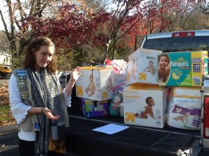 Hannah Sheboy with her donated items for Birth Right.
