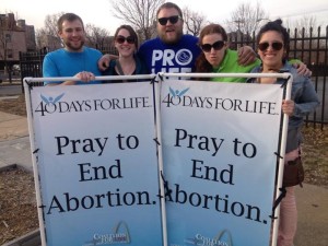 Joshua Schmidt, Maura Weis, Brad Baumgarten, Katy Guill, and Faith Mary promote life.