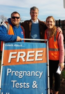 Brad, Patrick Burns, and Melissa DeRocher offering free pregnancy tests