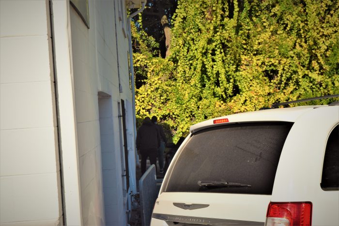 Abortion clinic security guard is seen exiting the clinic with the alleged attacker of a pro-life woman