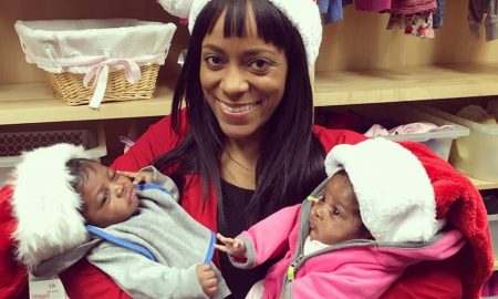 A pregnancy resource center employee, with with her client's twins. The babies were born close to Christmas after their mother changed her mind about abortion.