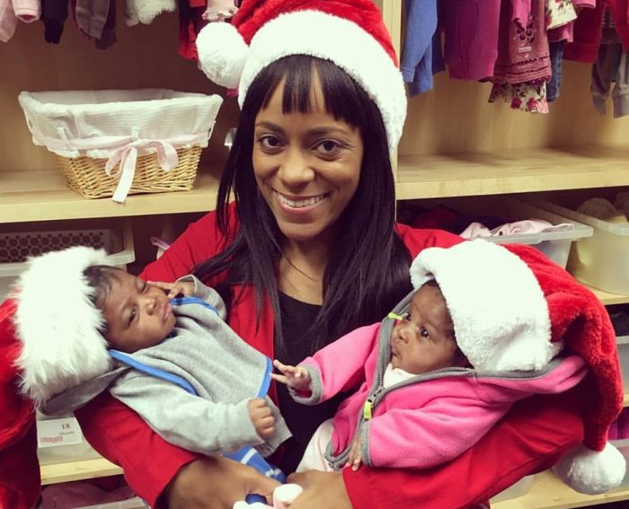 A pregnancy resource center employee, with with her client's twins. The babies were born close to Christmas after their mother changed her mind about abortion. Pregnancy centers offer practical help to any pregnant woman.