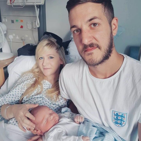 Charlie and his parents after his birth, just months before he became suddenly ill and needed life support. 