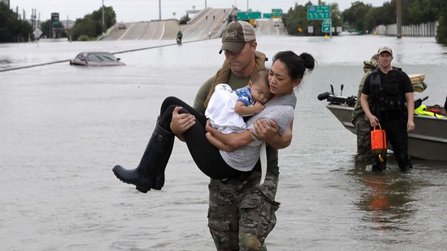 Houston Swat Officer saves baby and mom from Harvey floods (image credit AP)