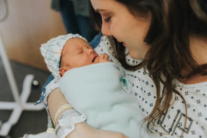 A story of why abortion for the life or health of the mother is not necessary. Dana Scatton, who was diagnosed with cancer, holds her daughter.