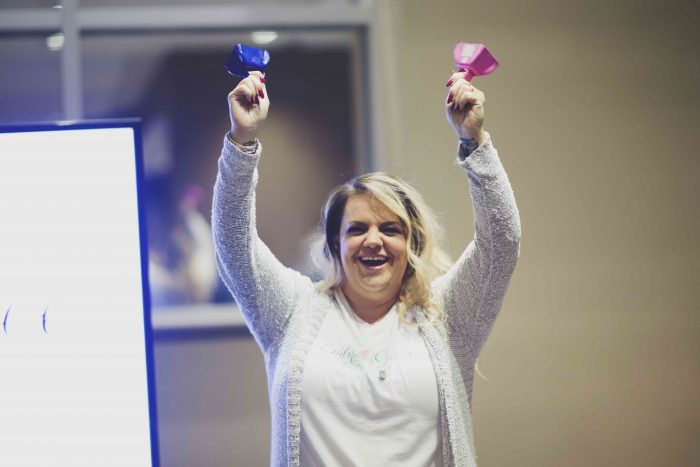 A volunteer celebrates Love Boxes. 