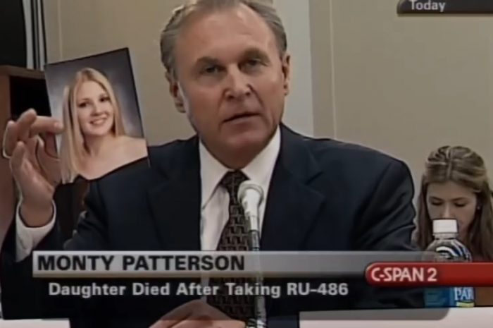 Image: Monty Patterson holds up pic of daughter dead after taking abortion pill at Planned Parenthood