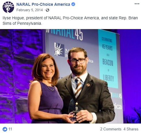 Image: Brian Sims accepts Champion of Choice Award from NARAL 2014 with Ilyse Hogue