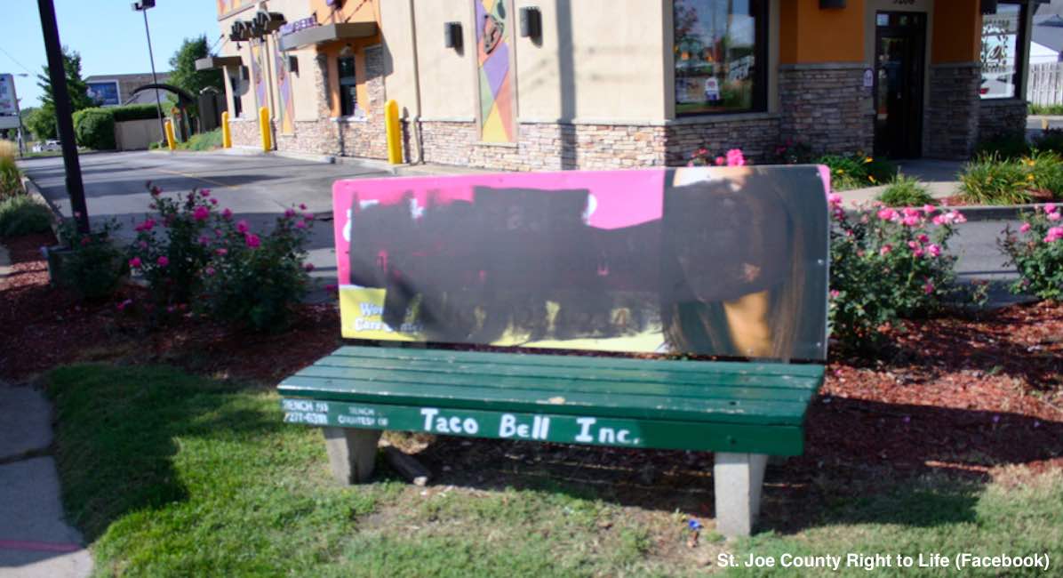 vandalized bench