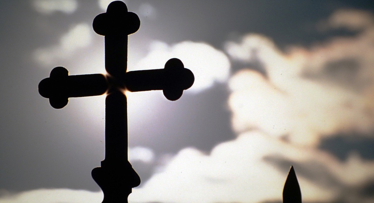 Silhouette Of Cross At Church Against Sky