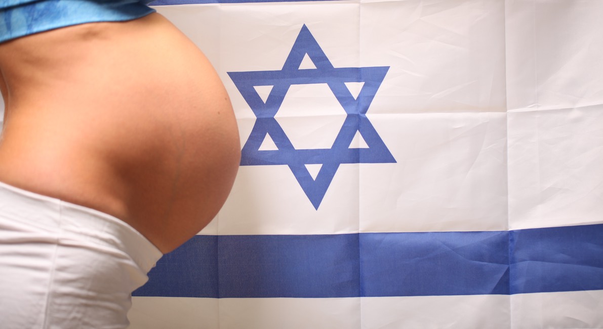 Fertility in Israel concept of a pregnant girl and Israel flag
