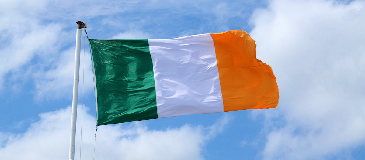 Low Angle View Of Irish Flag Against Sky