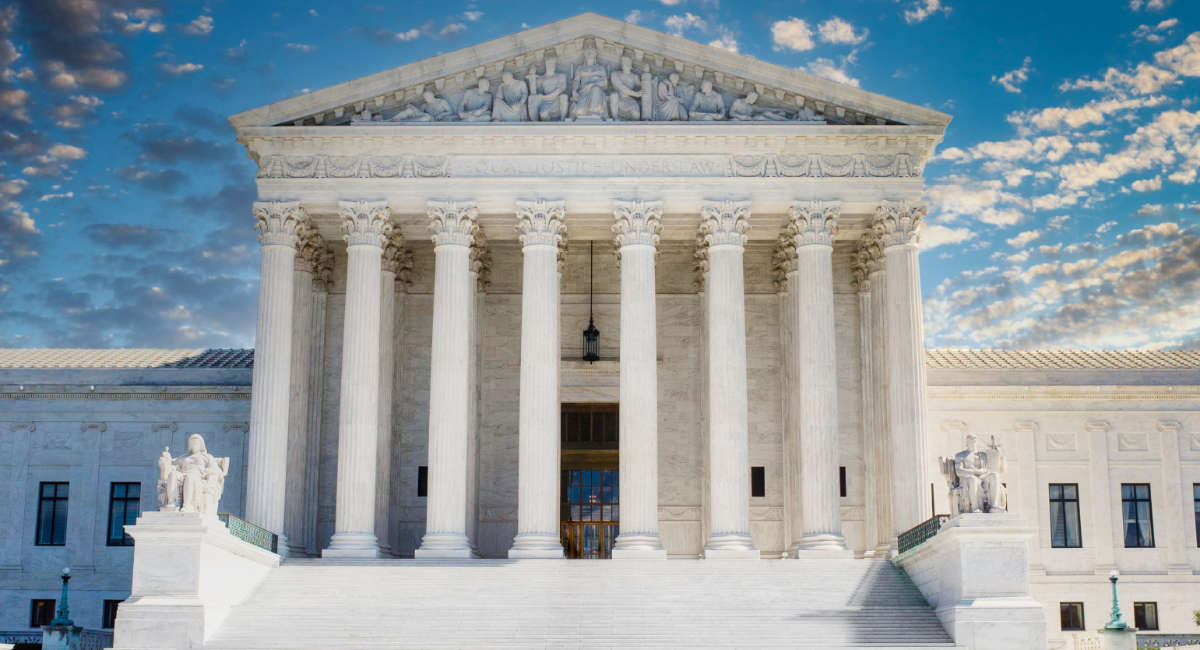 Supreme Court in Washington DC with dark storm clouds.