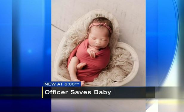 screenshot, officer saves baby