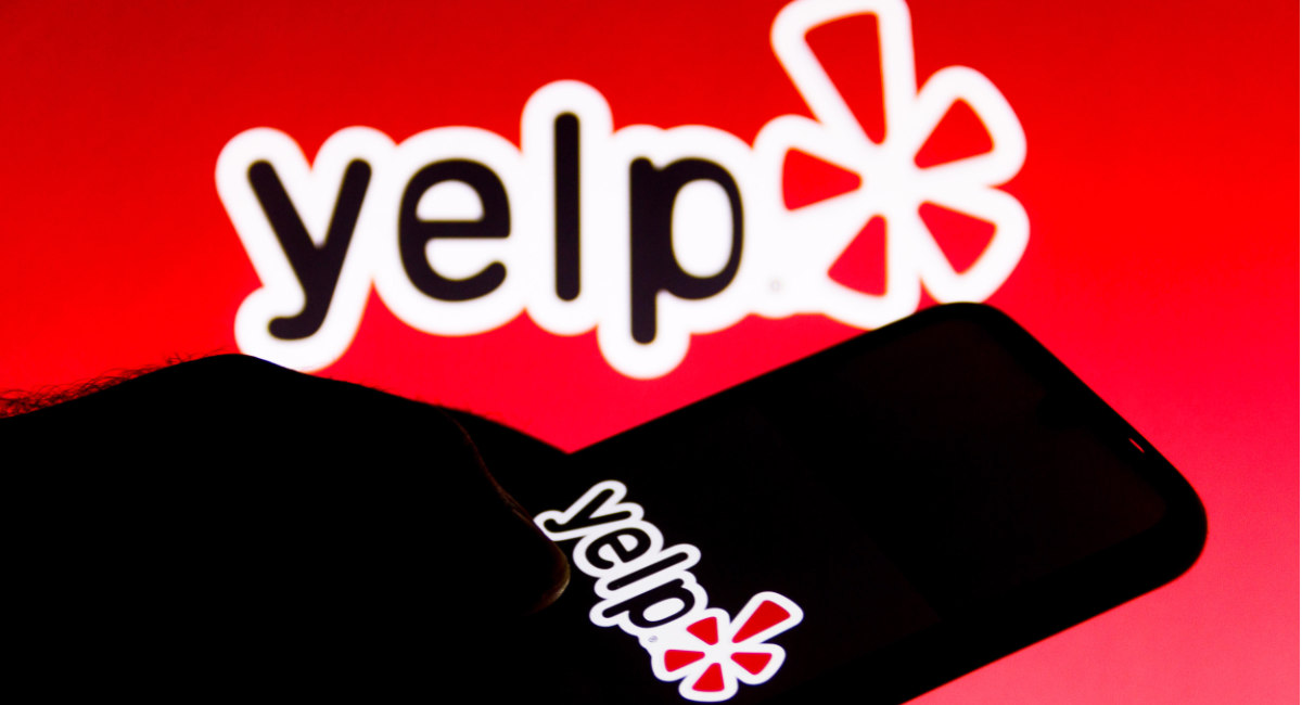 In this photo illustration a Yelp logo is seen on a