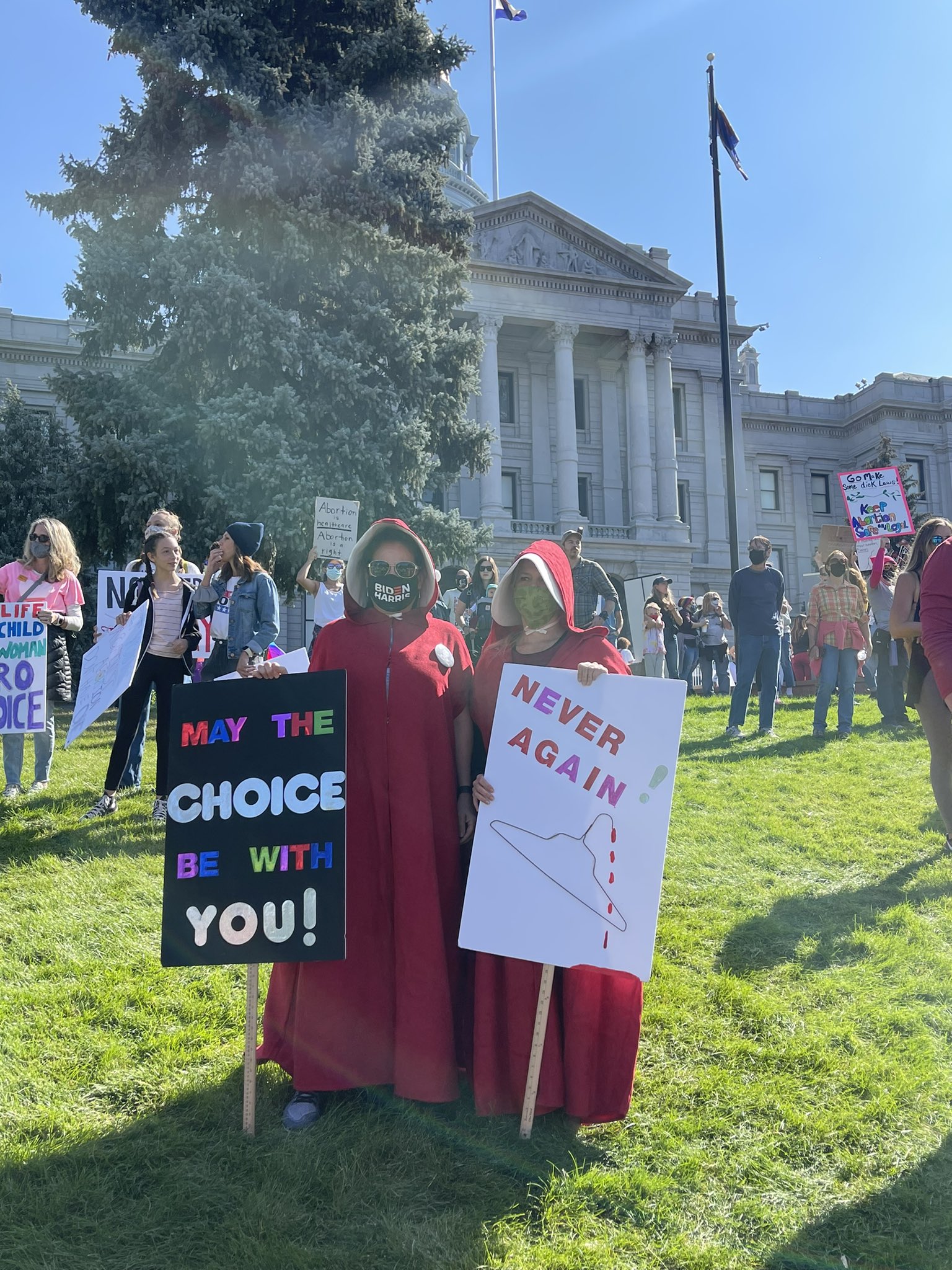 Image: Women's March Handmaiden holding Coat Hanger (Image: Twitter)