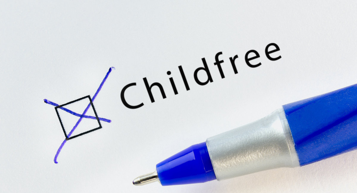 Childfree – checkbox with a cross on white paper with blue pen.