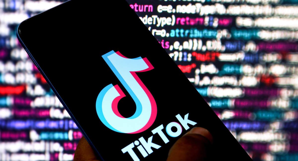 In this photo illustration, a Tiktok logo is displayed on a