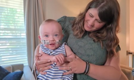 Preemie Nash Keen held by his mother.