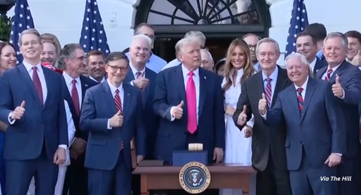 Trump gives a thumbs up after signing reconciliation bill surrounded by his wife Melania and federal legislators. The bill defunds Planned Parenthood for one year.